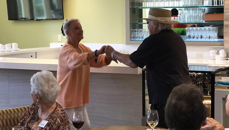 Seniors dancing in the cafe