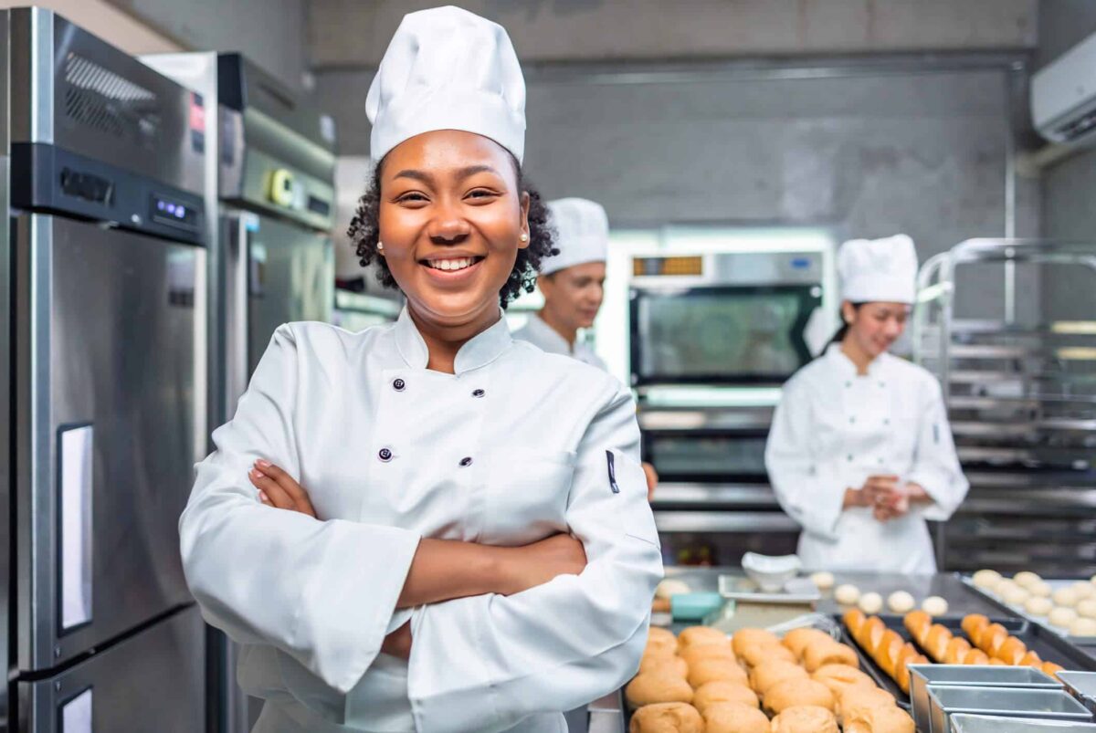 Chef in kitchen preparing for senior living dining