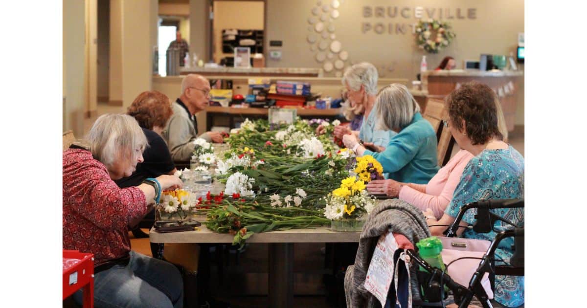 Seniors gather to arrange flowers