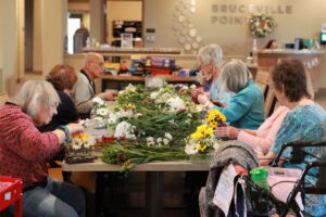 Seniors gather to arrange flowers