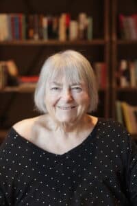 Photograph of Lindsey Lovett, a Bruceville Point Veteran Resident, smiling in the library